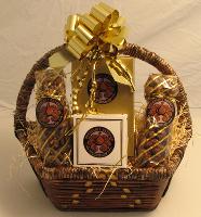 Chocolate Wall Basket  - This hanging wall basket is filled with a gold box filled with six large assorted Signature Chocolates; a four-piece box of assorted Old World Truffles; a gold bag of chocolate covered mini pretzels coated with English toffee pieces; and a gold bag of chocolate covered caramel corn.  The basket is shrink wrapped and topped with a bow.